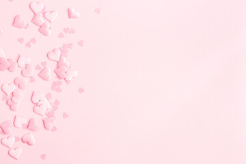 Valentine's Day background. Pink hearts on pastel pink background. Valentines day concept. Flat lay, top view, copy space