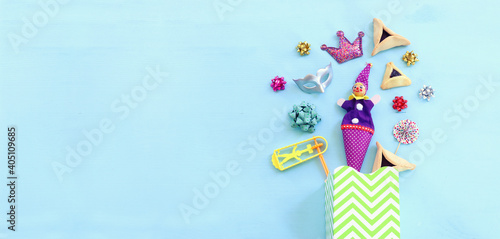 Purim celebration concept  jewish carnival holiday  over wooden blue background. Top view  flat lay