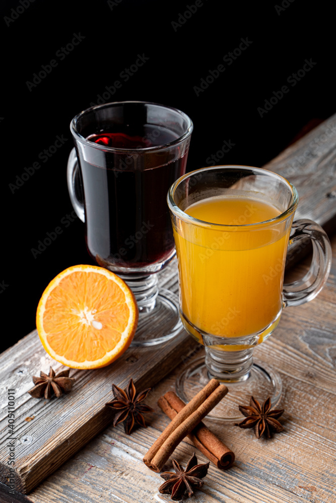 Seasonal hot beverages on wooden rustic table with ingredients on it, top view Seasonal hot beverages on wooden rustic table with ingredients on it, top view