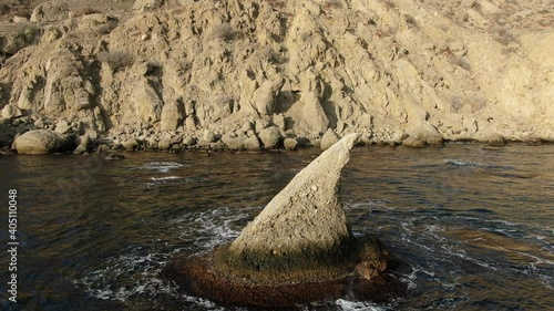 Earth planet nature diversity idea. Amazing natural forms: a shark fin shaped reef. Shark Bay Cape Meganom Crimea 2020 photo