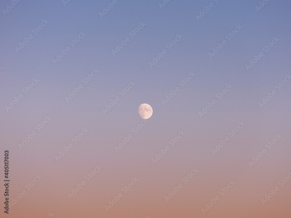 Near full moon in tranquil dusk sky
Near full moon in tranquil dusk sky