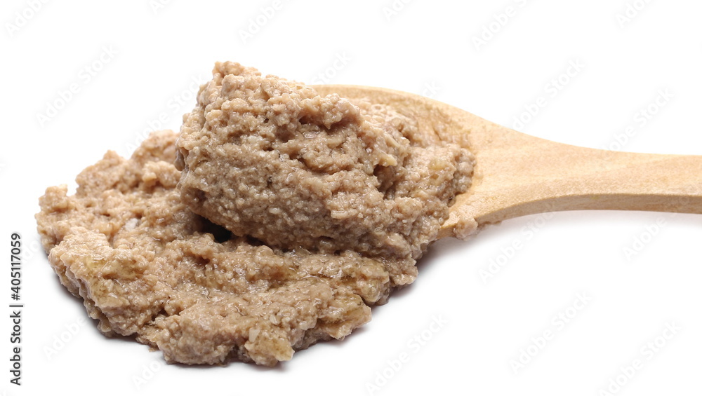 Cat food with chicken ingredients and wooden spoon isolated on white background Cat food with chicken ingredients and wooden spoon isolated on white background