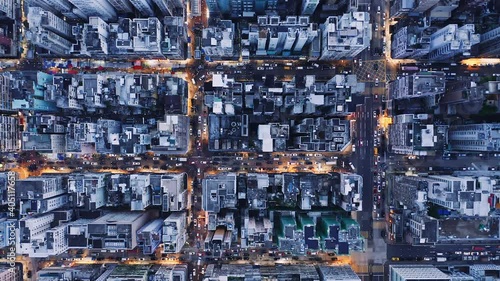 Aerial overhead view of city at night with buildings and streets in Kowloon, Hong Kong photo