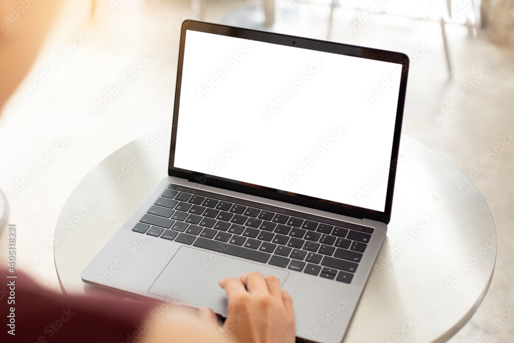 computer screen blank mockup.hand woman work using laptop with white background for advertising,contact business search information on desk at coffee shop.marketing and creative design computer screen blank mockup.hand woman work using laptop with white background for advertising,contact business search information on desk at coffee shop.marketing and creative design
