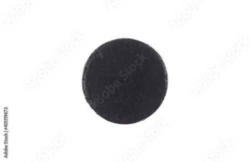 old hockey puck isolated on white background