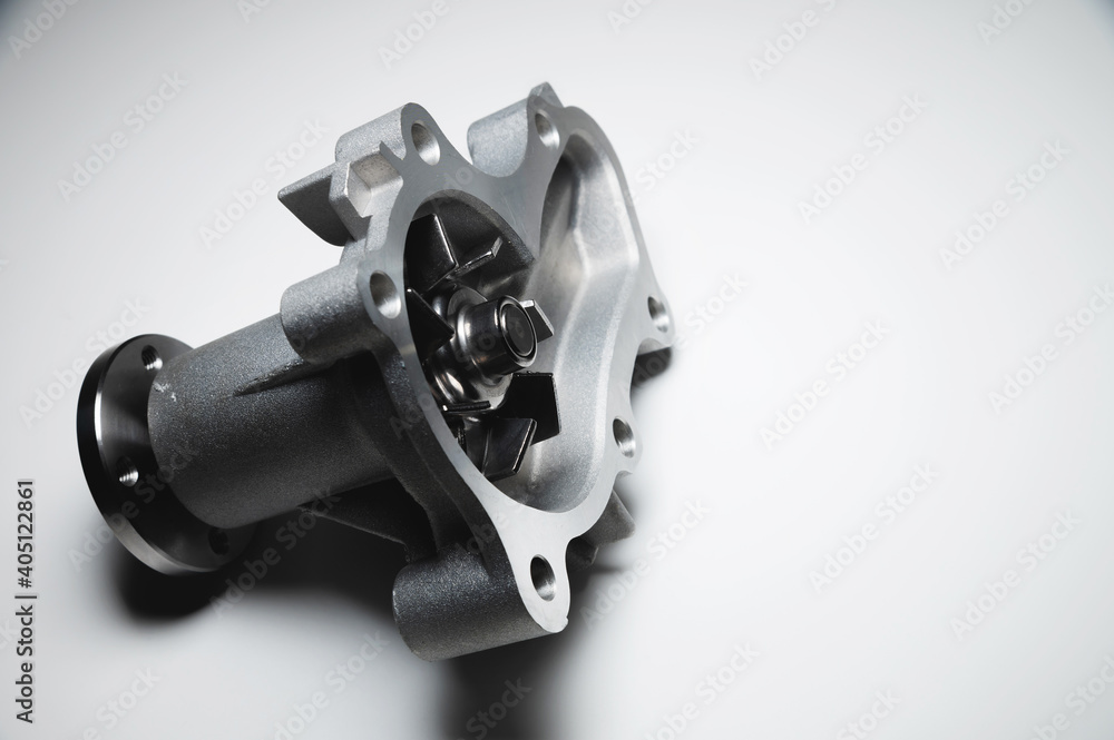 Obraz premium Engine coolant pump. New spare part on a contrasting gradient background for car services