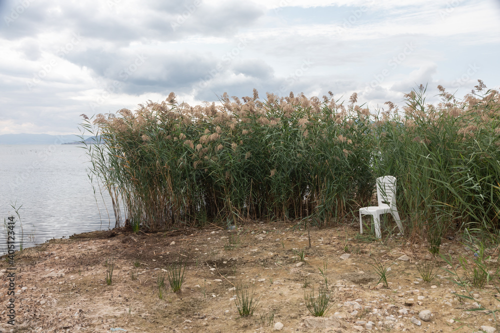 plastic chairs set up amid the reeds along Lake Iznik