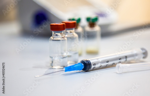 vaccine bottles and syringe for injection