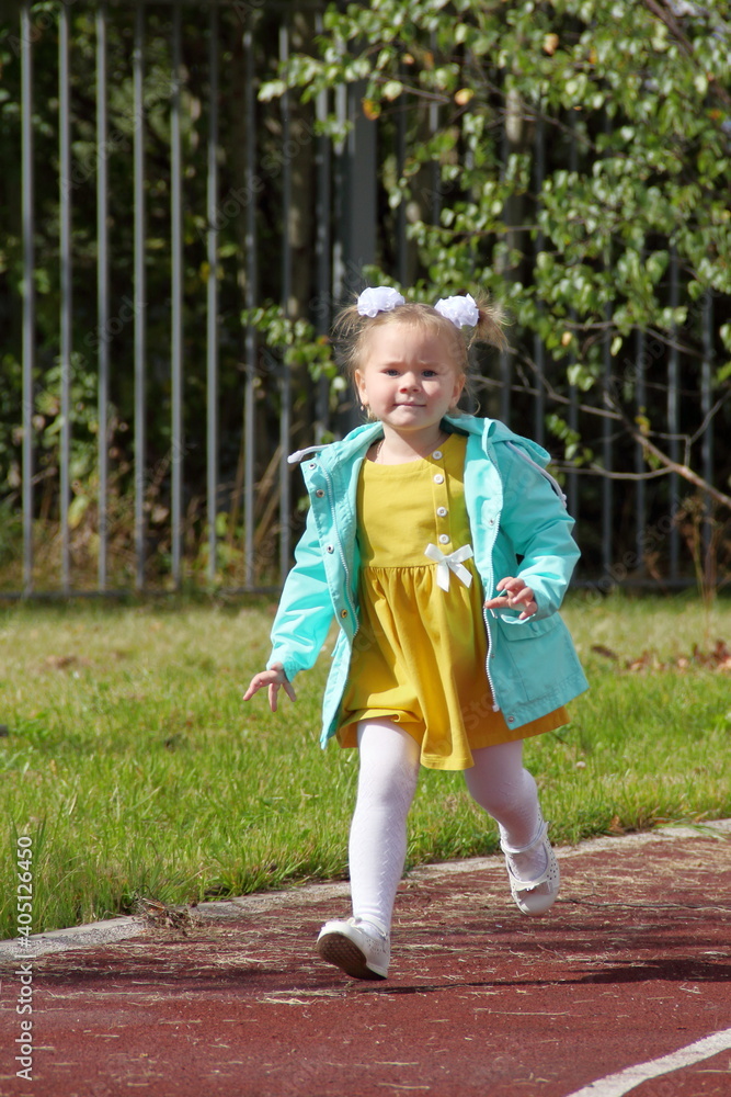 little child playing in the park little child playing in the park