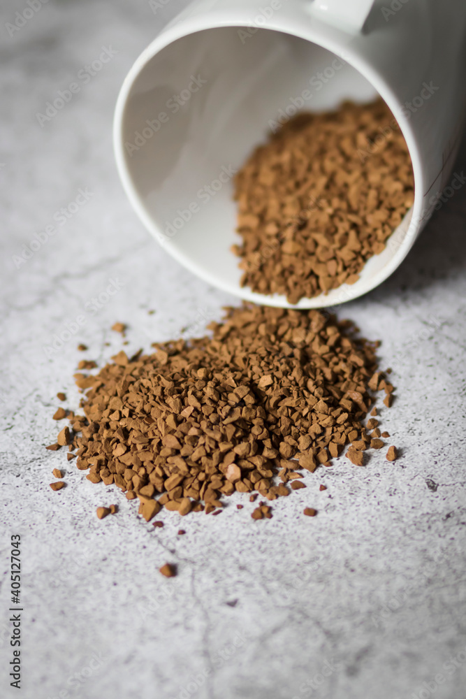 Instant coffee with white cup on gray background Instant coffee with white cup on gray background