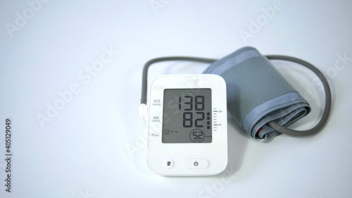 Electronic blood pressure meter and cuff on white background, Medical electronic tonometer check blood pressure, Health and Medical concept