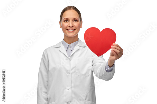 medicine, healthcare and cardiology concept - smiling female doctor with red heart
