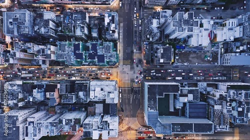 Aerial overhead view of city at night with buildings and streets in Kowloon, Hong Kong