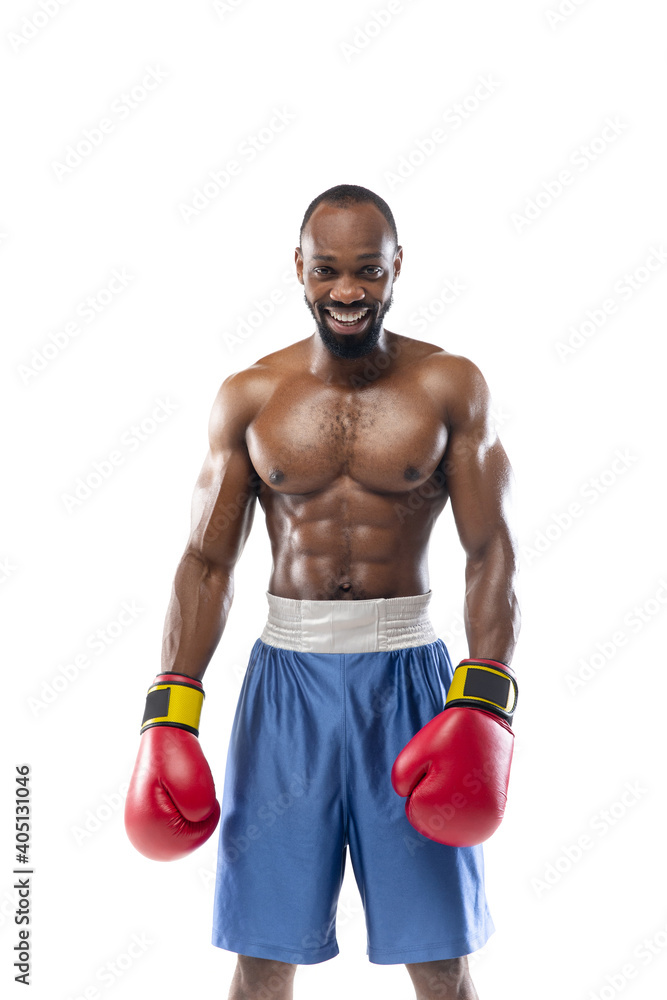 Smiling. Funny, bright emotions of professional african-american boxer isolated on white studio background. Excitement in game, human emotions, facial expression and passion with sport concept.