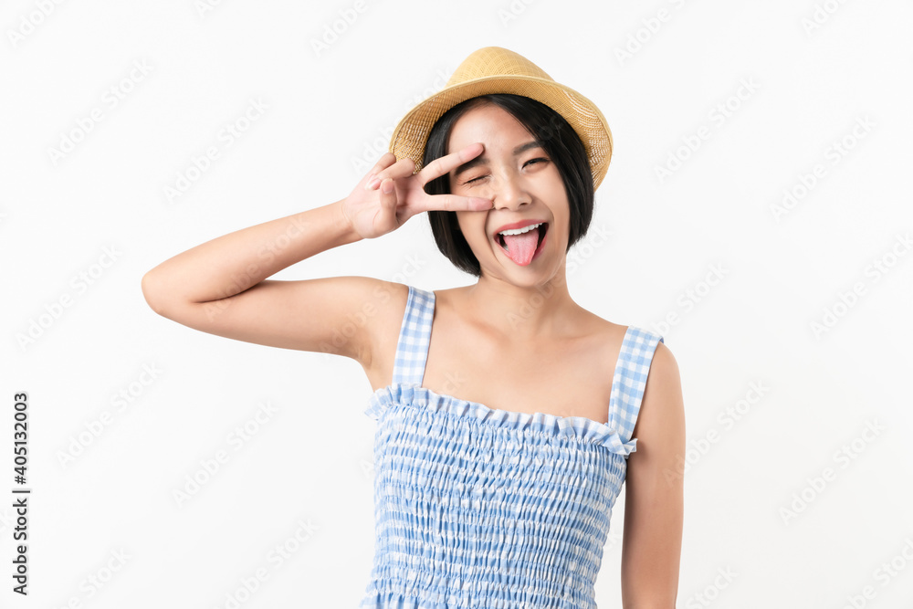 Studio shot of cheerful beautiful Asian woman in blue color dress and wearing a hat and stand on white background. Studio shot of cheerful beautiful Asian woman in blue color dress and wearing a hat and stand on white background.