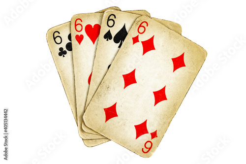 Four old dirty sixes poker cards on a white background