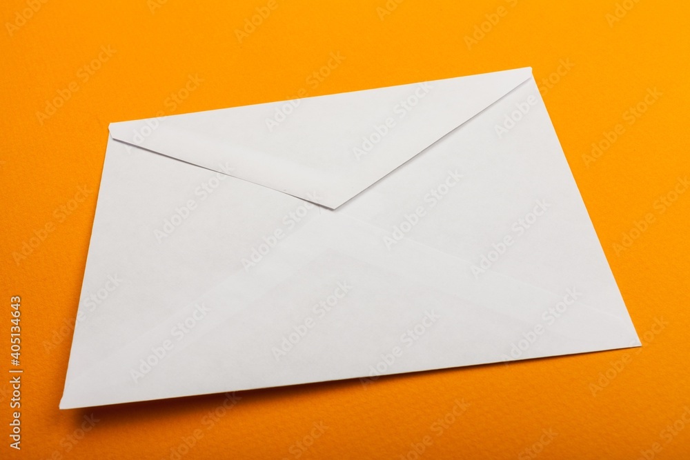 Envelope, white blank letter on desk Envelope, white blank letter on desk
