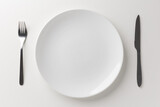 White empty plate set Placed with a knife and fork Ready for food menu
