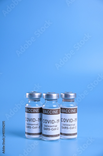 Coronavirus vaccine - The medical concept. Ampoule with Covid-19, SARS-Cov-2 vaccine. Copyspace. Vaccination, immunization, treatment to cure Covid 19 Corona Virus infection Concept