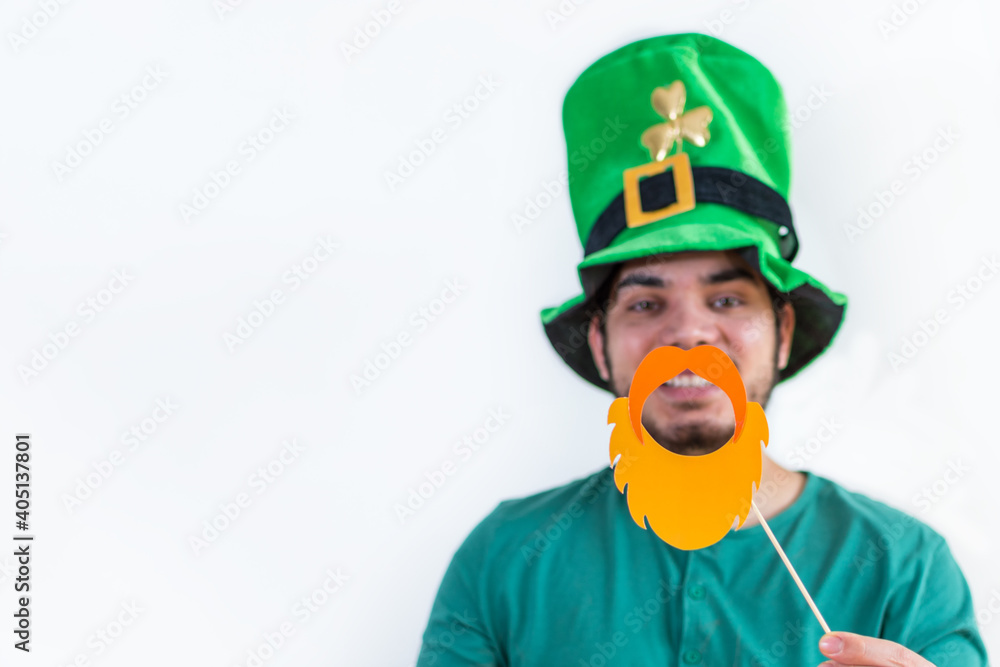St Patrick´s day. Man in a leprechaun hat with beard wearing green costume for party. St Patrick´s day. Man in a leprechaun hat with beard wearing green costume for party.