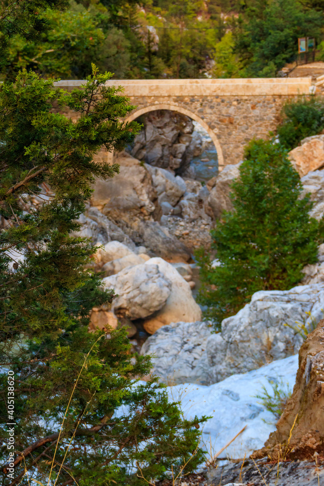 Ancient stone bridge across a mountain river in Kesme Bogaz canyon, Antalya province in Turkey Ancient stone bridge across a mountain river in Kesme Bogaz canyon, Antalya province in Turkey