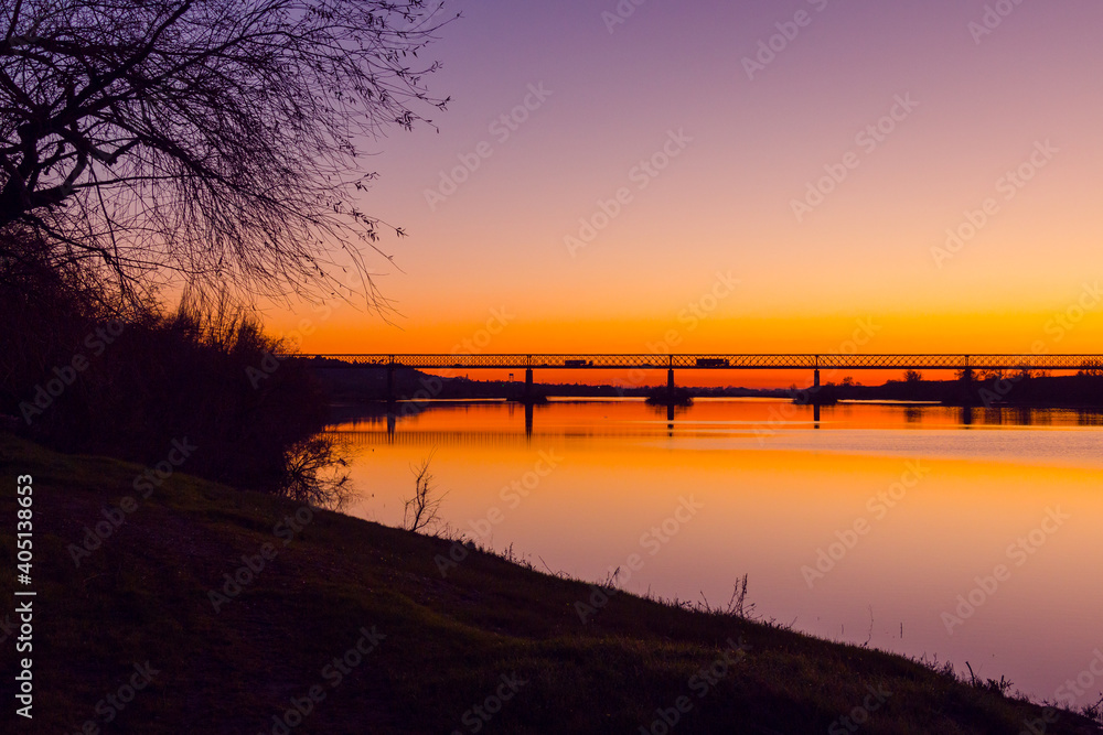 Bridge at sunset. Steel bridge over the Tagus river in Chamusca, Portugal