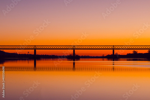 Bridge at sunset. Steel bridge over the Tagus river in Chamusca, Portugal © WildGlass Photograph