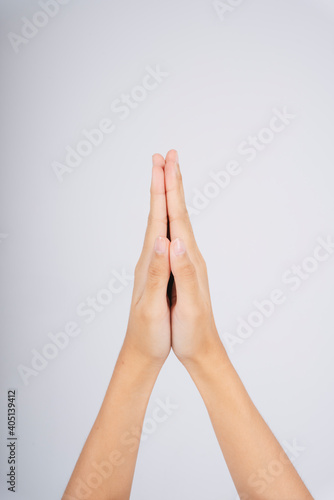 Woman hand praying symbol hold hand together. Pray and gratitude. Hello  Thank you  and good bye in Thai meaning.