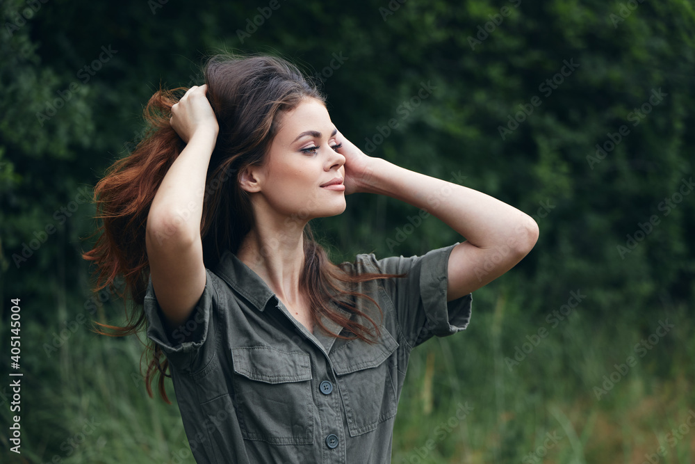 Woman outdoors Fresh air holds hands near the travel face 
