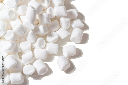 Isolate of white marshmallows on a white background with hard shadows. Copy space.