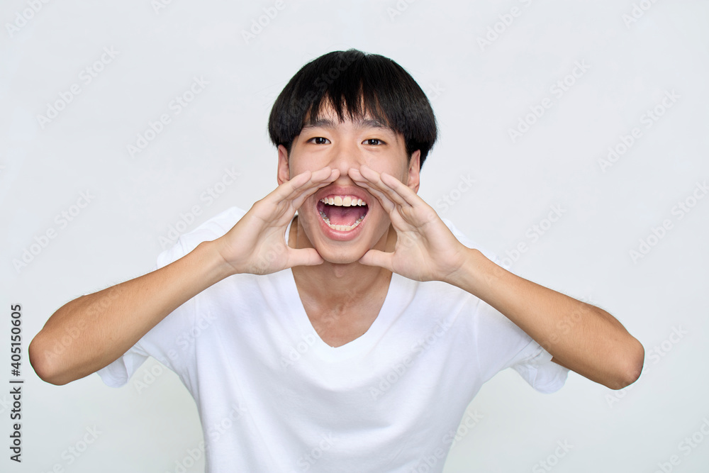young man holding hands near opened mouth Announcement young man holding hands near opened mouth Announcement