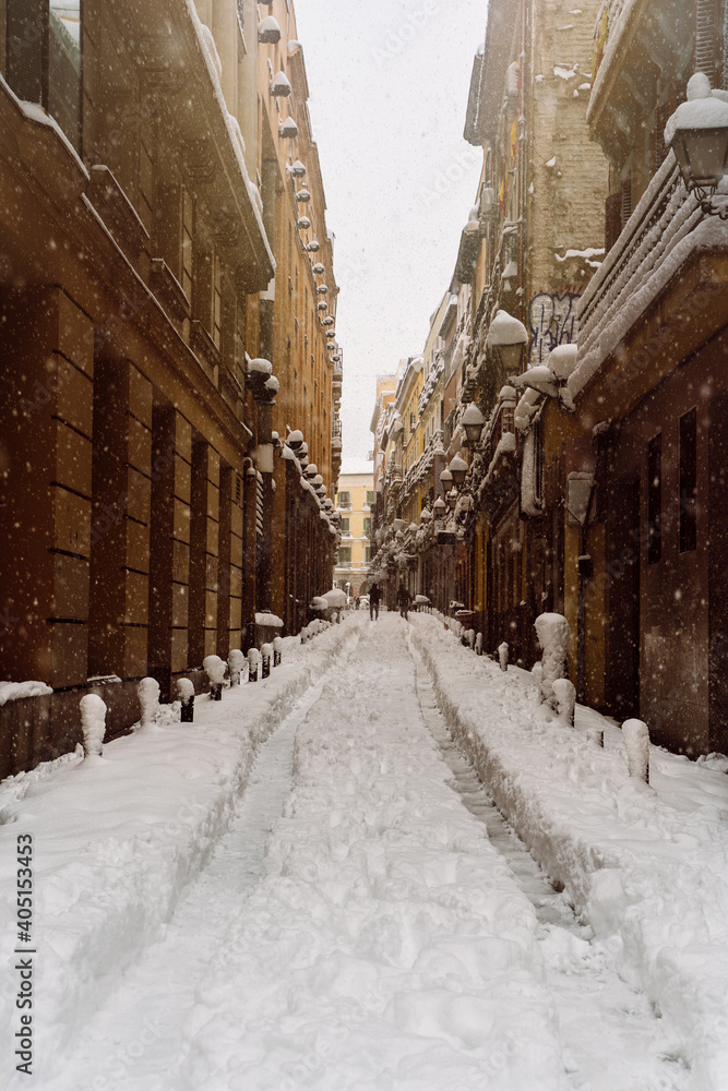 Street covered under snow in the city center of Madrid during the snowfall due to Filomena storm in Spain