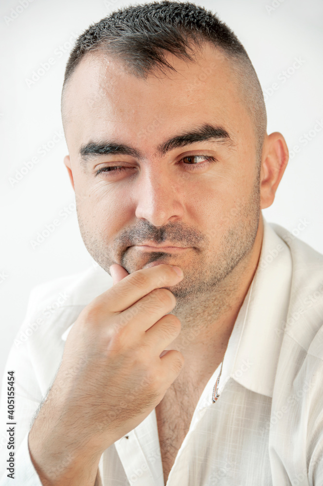 Portrait of a charismatic man with an expression of on his face. Emotions for posters or banners. Portrait of a charismatic man with an expression of on his face. Emotions for posters or banners.