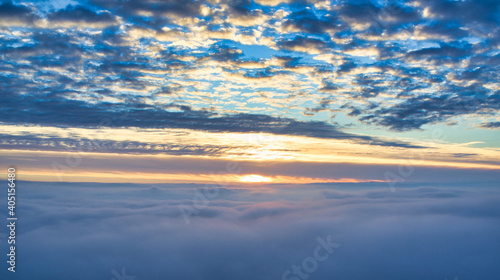 Mystical sunrise over clouds