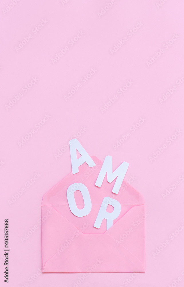 Pink envelope and text AMOR on a light pink background Pink envelope and text AMOR on a light pink background
