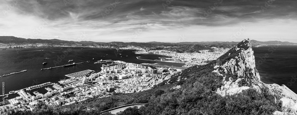 Black and white panoramic aerial view of the rock of Gibraltar, roof tops and the port of Gibraltar, Iberian peninsula, UK