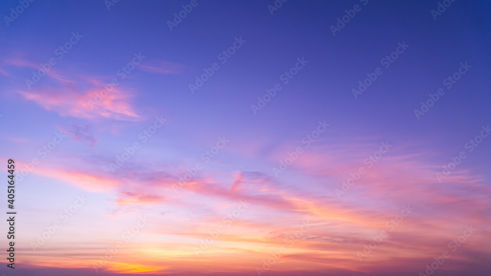 Sunset sky in the evening on twilight with colorful sunlight clouds nature background