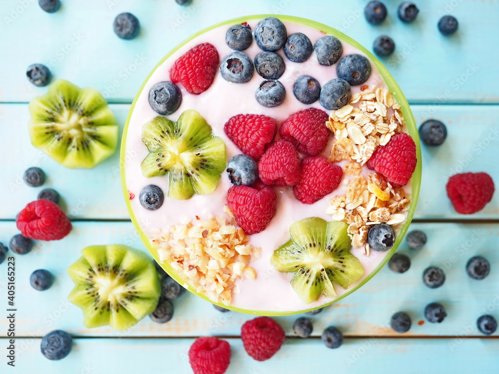 Healthy breakfast - the bowl of oat granola with yogurt, fresh raspberries, blueberries and nuts
Healthy breakfast - the bowl of oat granola with yogurt, fresh raspberries, blueberries and nuts