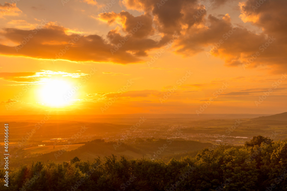 Colorful gold red sunset over Beskydy landscape and surrounding nature.