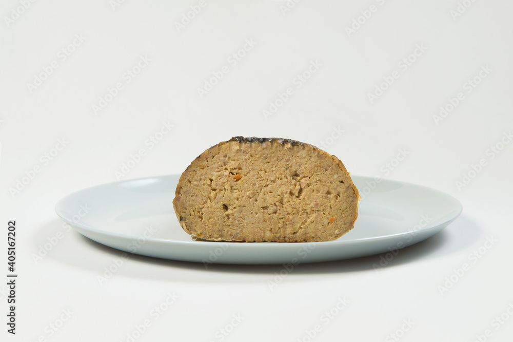 Stuffed carp fish. Jewish traditional whole gefilte fish cut served on plate isolated on white background. Minced fish fillet with vegetables in fish skin backed in oven. Dish isolated on white
Stuffed carp fish. Jewish traditional whole gefilte fish cut served on plate isolated on white background. Minced fish fillet with vegetables in fish skin backed in oven. Dish isolated on white