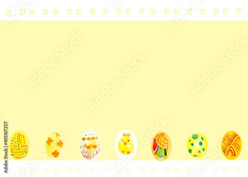 A yellow frame decorated with easter eggs and a babychick photo