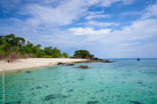 Seascape of Koh khai islands for travel in clear white sand beach and blue skyline