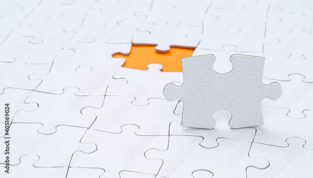 Empty white jigsaw puzzle with missing piece Empty white jigsaw puzzle with missing piece
