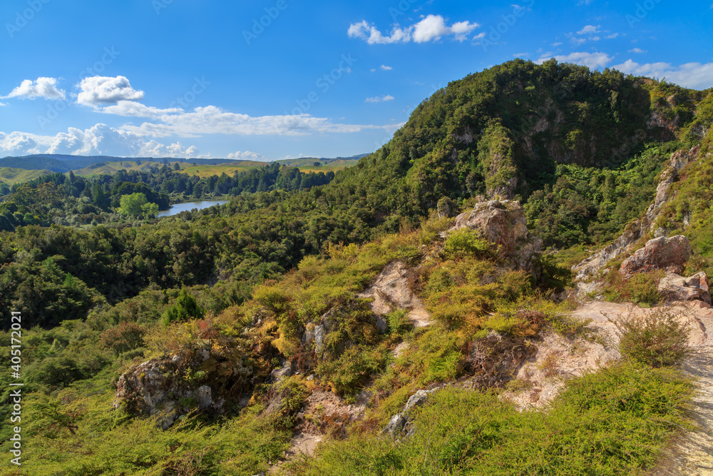 View from Rainbow Mountain, a geothermally active peak with colorful soils in the Rotorua area, New Zealand. To the left is Lake Ngahewa