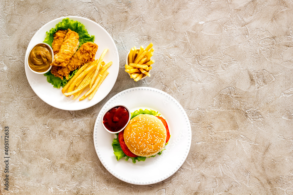Overhead view of fast food - burger and french fries, flat lay Overhead view of fast food - burger and french fries, flat lay