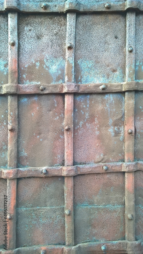 Old riveted metal door close-up Old riveted metal door close-up