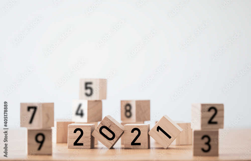 Flipping of wooden cubes block of 2021 year. Merry Christmas and happy new year concept. Flipping of wooden cubes block of 2021 year. Merry Christmas and happy new year concept.
