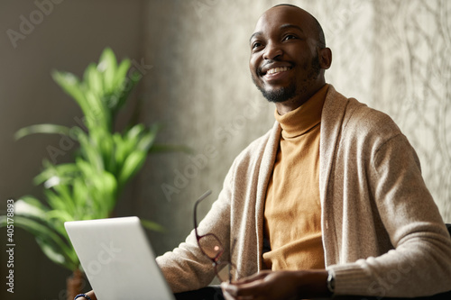 Portrait of positive friendly smiling black african creative business man photo