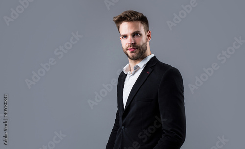 stylish guy with trendy hairstyle wear office suit, barber