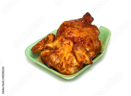 Grilled chicken on a plate on a white background.